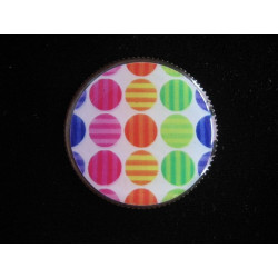 RING graphic, multicolored polka dots on a white background, set with resin