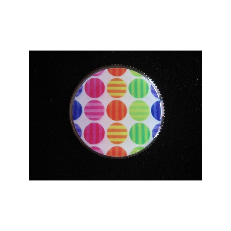 RING graphic, multicolored polka dots on a white background, set with resin