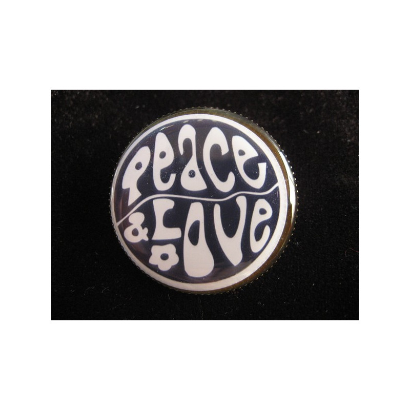 Vintage brooch, Peace and love, on black background, set with resin