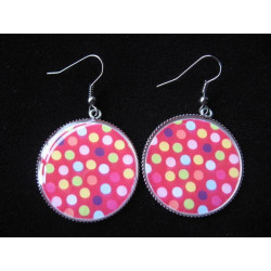 Fancy earrings, multicolored dots on a red background, set in resin