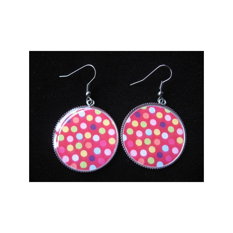 Fancy earrings, multicolored dots on a red background, set in resin