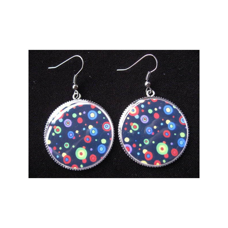 Fancy earrings, multicolored polka dots on a black background, set in resin