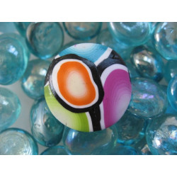 Pop ring, multicolored patterns, on a white background in Fimo