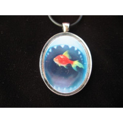 Oval pendant, fish and shark, set with resin