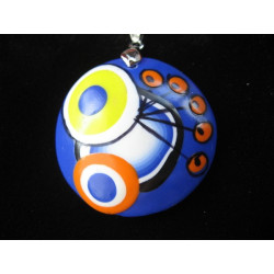 Pop pendant, multicolored patterns, on a blue background, in Fimo