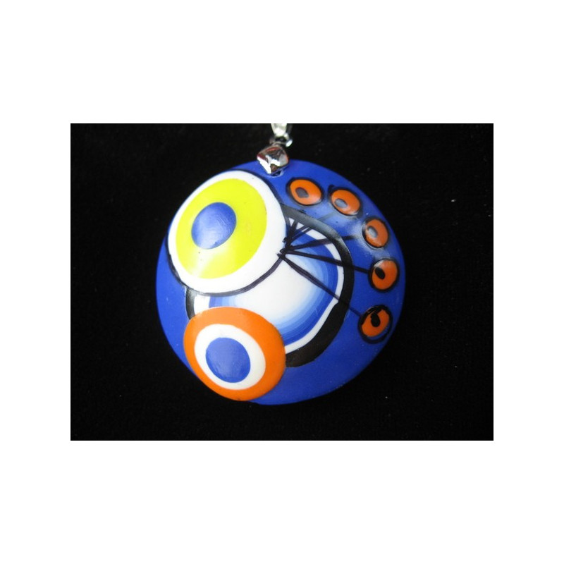 Pop pendant, multicolored patterns, on a blue background, in Fimo