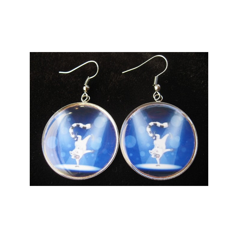 Earrings, lemur dancer, set in resin