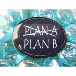 Fancy oval brooch, Plan A or Plan B, set in resin