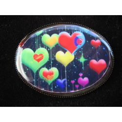 Oval brooch, multicolored hearts on black background, set with resin