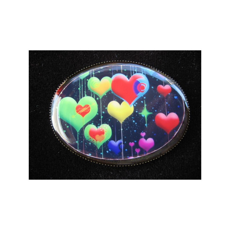Oval brooch, multicolored hearts on black background, set with resin