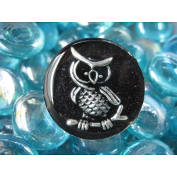 Fancy ring, silver owl, on black resin background