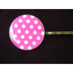 Fancy hair clip, white dots, on a fuchsia background