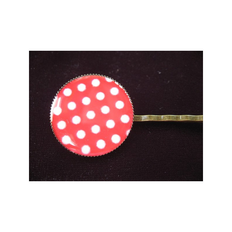 Fancy hair clip, white dots, on a red background