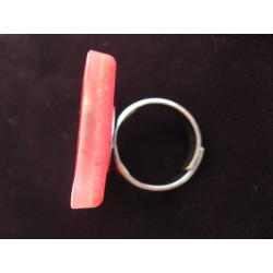 Square ring, black microbeads, on a red resin background
