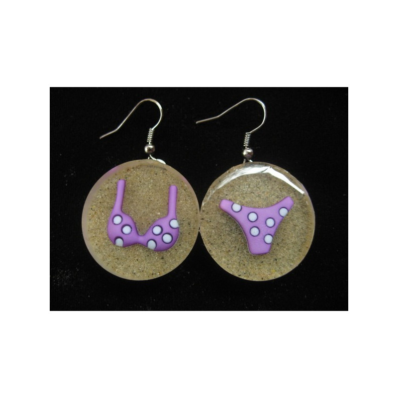 Earrings, purple bikini, on resin sand background