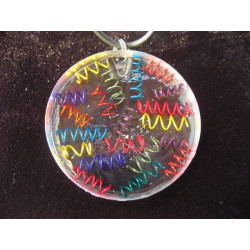 Graphic pendant, multicolored springs, on resin transparent background