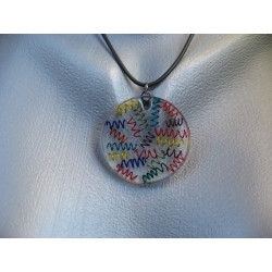 Graphic pendant, multicolored springs, on resin transparent background