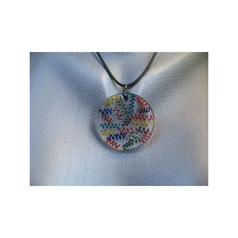 Graphic pendant, multicolored springs, on resin transparent background