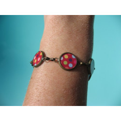 BRACELET small cabochons, multicolored polka dots on a red background