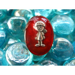 Small oval ring, little boy, on a red resin background