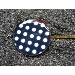 Fancy hair clip, white dots, on a black background