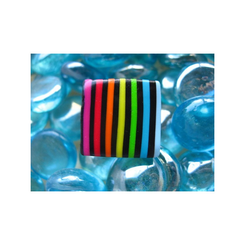 Small pop ring, multicolored stripes, on a black background, in Fimo