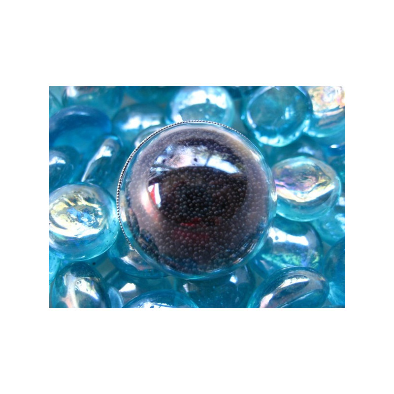 Dome ring, mobile black microbeads, in a plexi half-sphere