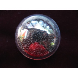 Dome ring, mobile black microbeads, in a plexi half-sphere