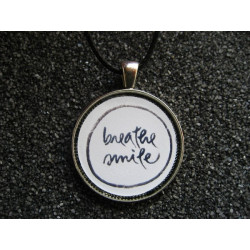 Zen pendant, Breather Smile, set in resin
