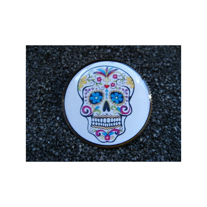 Steampunk brooch, Mexican skull on a white background, set with resin