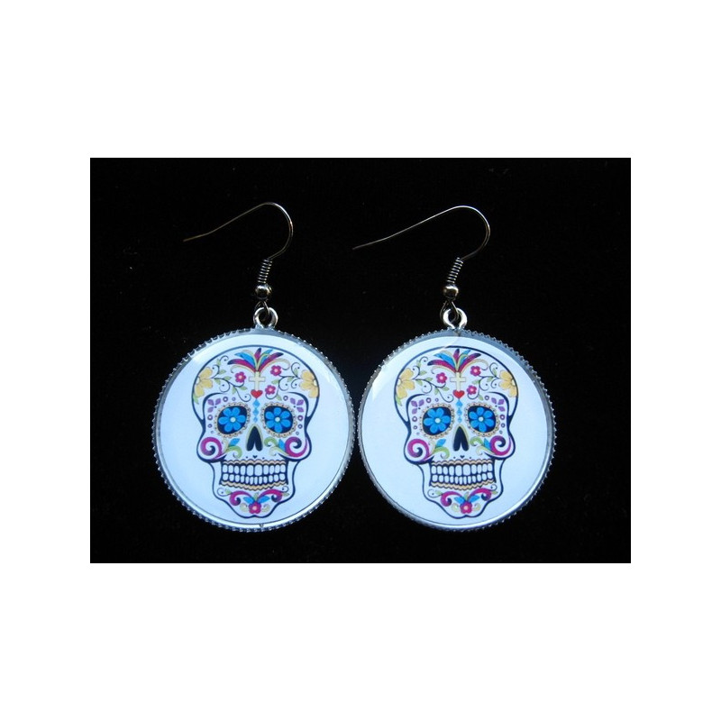 Earrings, mexican skull on a white background