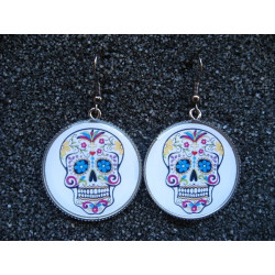 Earrings, mexican skull on a white background