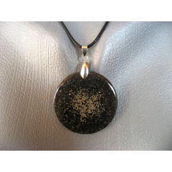 Fancy pendant, silver microbeads, on a black resin background