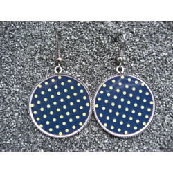 Earrings, gold dots on black background, set in resin