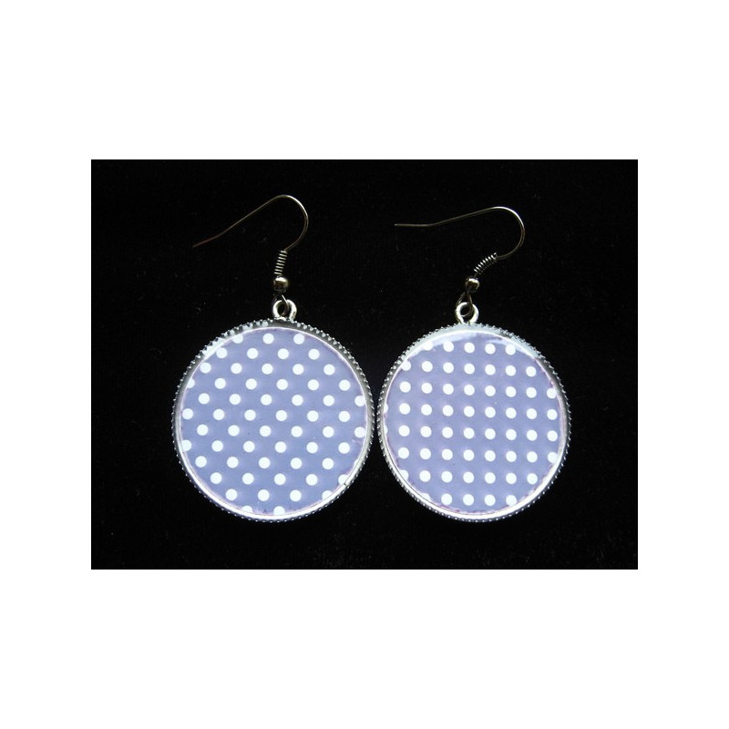 Fancy earrings, white dots on a gray background, set in resin