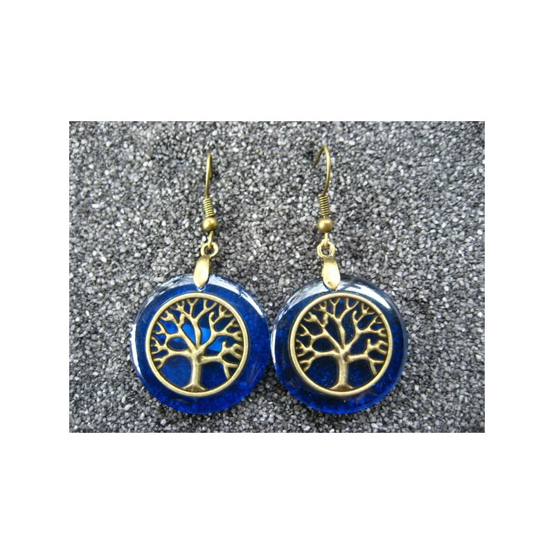 Zen earrings, Bronze tree of life, on blue resin background