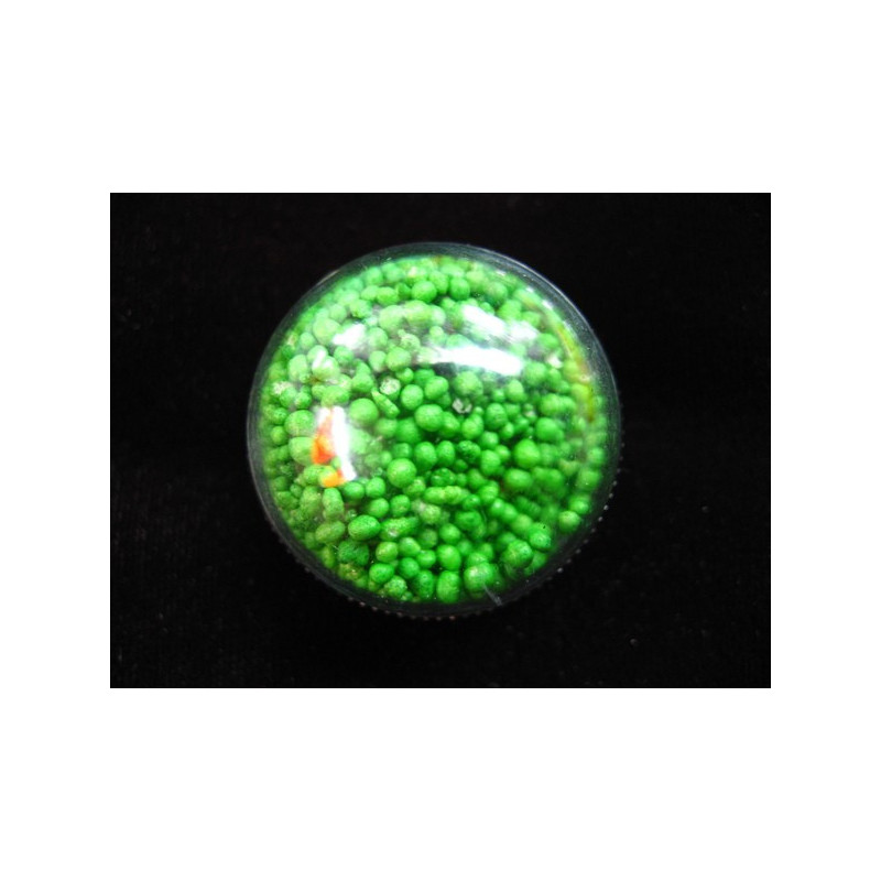 Dome ring, mobile green minipearls, in a plexiglass hemisphere