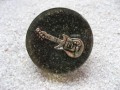 Large fancy ring, silver guitar, on a black resin background