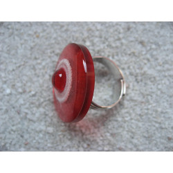 Fancy RING, red pearl, on white and red resin background
