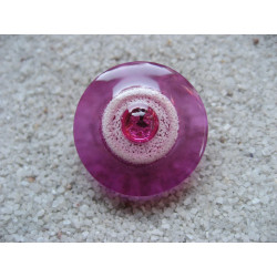 Fancy ring, fuchsia pearl, on white background and fuchsia in resin