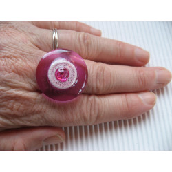 Fancy ring, fuchsia pearl, on white background and fuchsia in resin