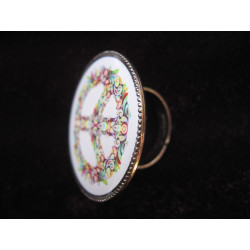 Vintage ring, peace and love multicolored on white background, set in resin