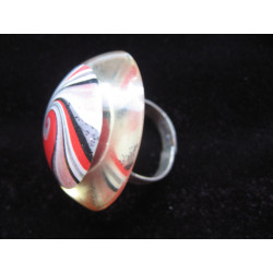 Very large cabochon ring, white and red spiral, on transparent resin background