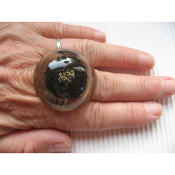 Very large cabochon ring, silver microbeads, on black resin background