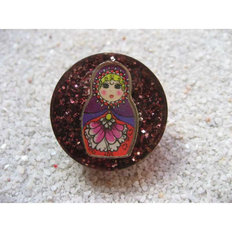 Fancy ring, Russian doll, on plum resin background