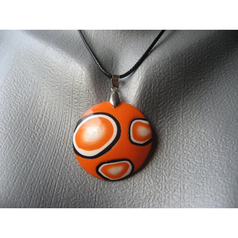 Pop pendant, black and white patterns on an orange background, in fimo