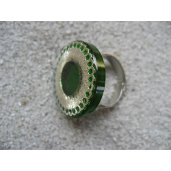 RING graphic, silver print, on green resin background