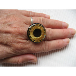 RING graphic, gold print, on black resin