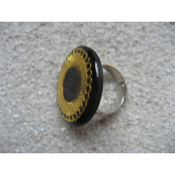 RING graphic, gold print, on black resin