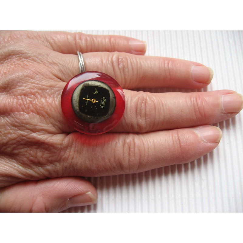 Vintage RING, black watch dial, on fuchsia resin background